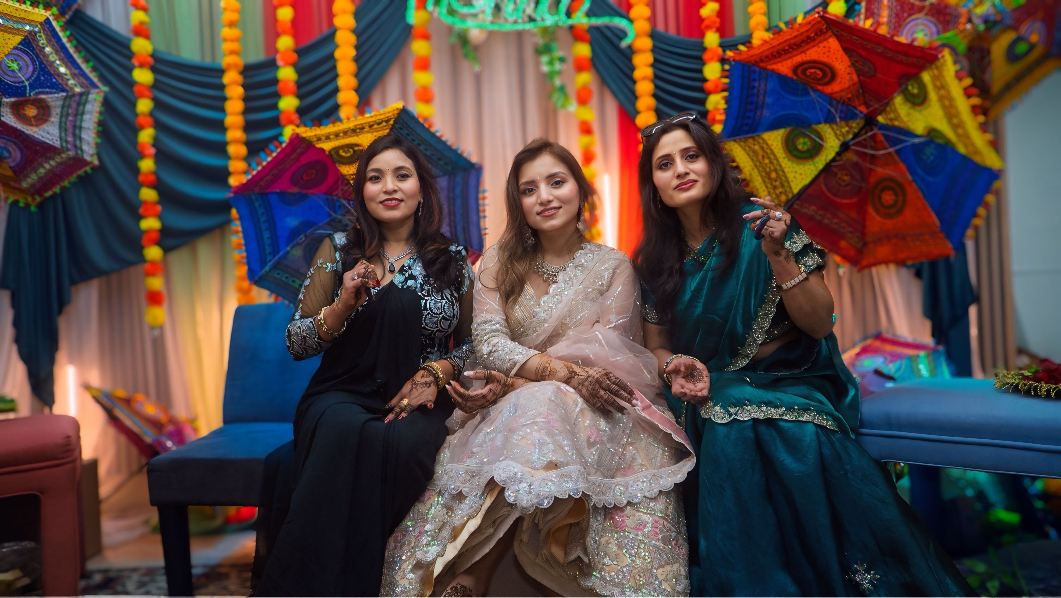 Full bridal look — bride showcasing henna hands and embroidered lehenga